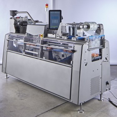 QX-500: New ultra compact, high performance Traysealer:  More performance with less space!  photo